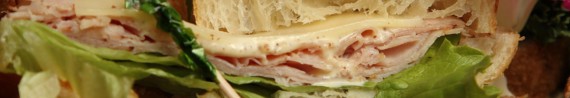 Eating Sandwich at Your Belly's Deli restaurant in Bennington, VT.